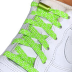 Elastische veters zonder strikken reflecterend 7mm capsule sluiting fluorescerend groen detailfoto van hoe de sluiting werkt