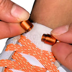 Elastische veters zonder strikken reflecterend 7mm capsule sluiting oranje detailfoto van hoe de sluiting werkt