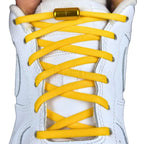 Elastische veters zonder strikken rond 5mm capsule sluiting geel met stretch uitgerekt