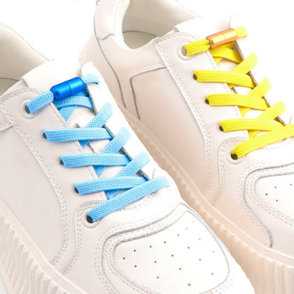 flat-elastic-no-tie-shoelaces-light-blue-yellow-twist-capsule-displayed-on-sneakers