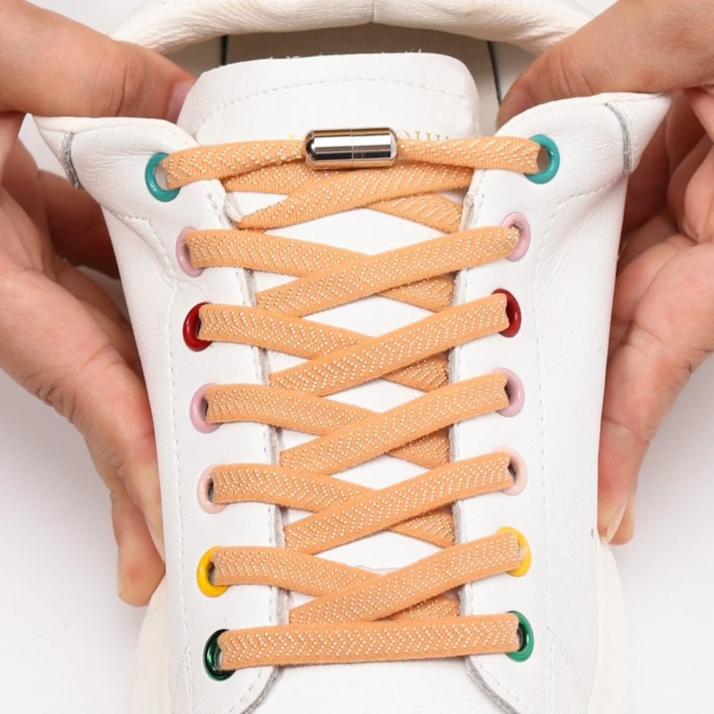 light brown textured elastic no-tie shoelaces with a twist capsule lock stretched in shoe